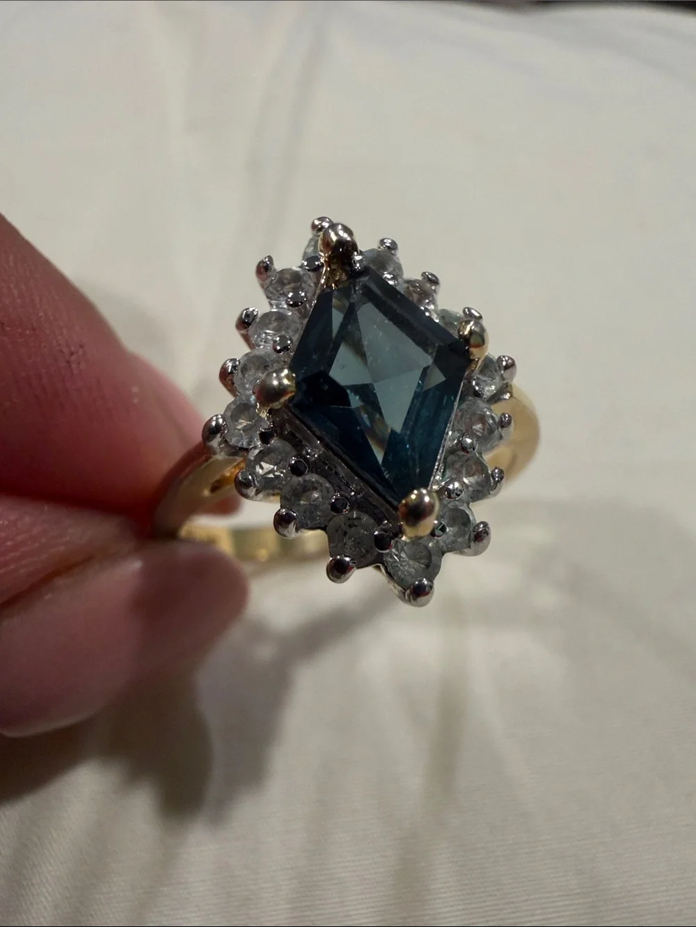 18K Gold Electroplated Ring with Deep Blue Kite-Cut Center and Clear Stones.